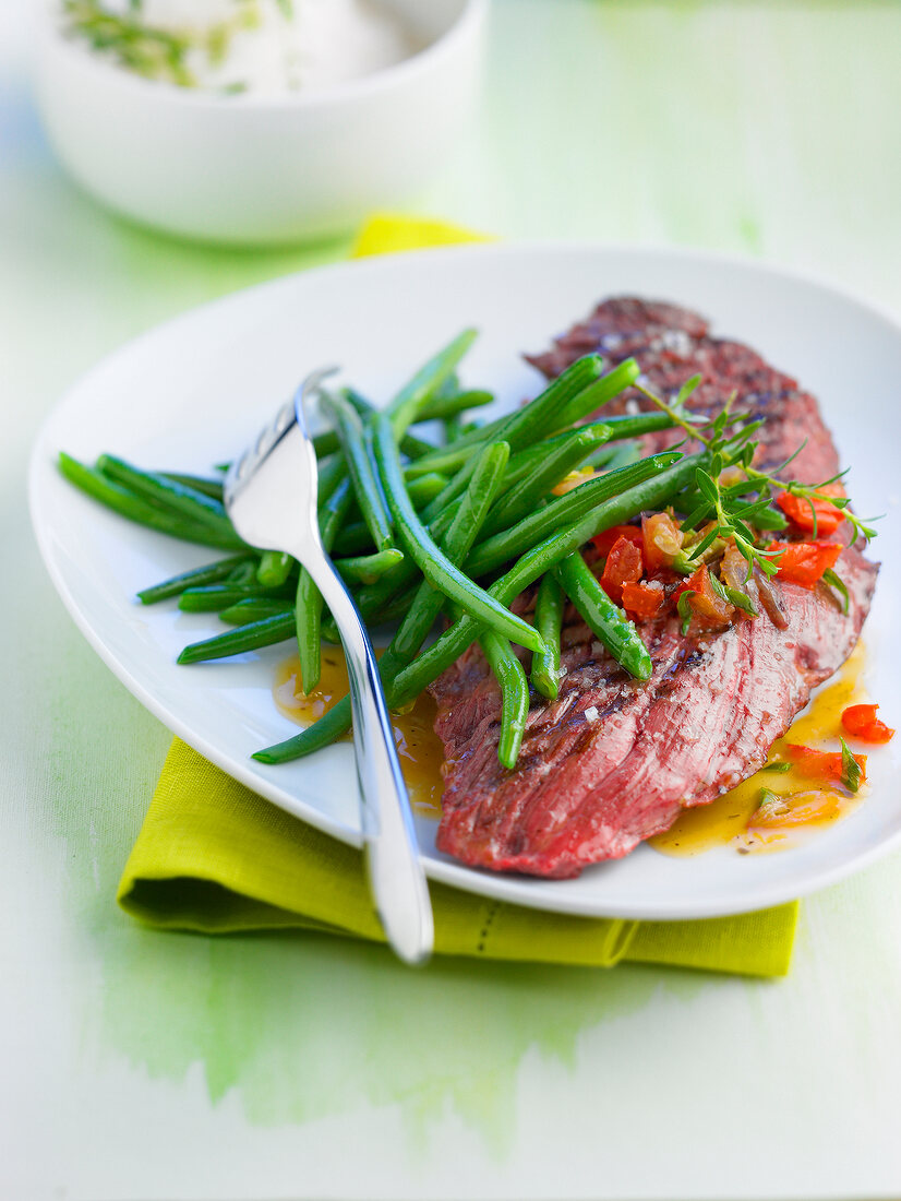 Grilled beef steak with steamed green beans