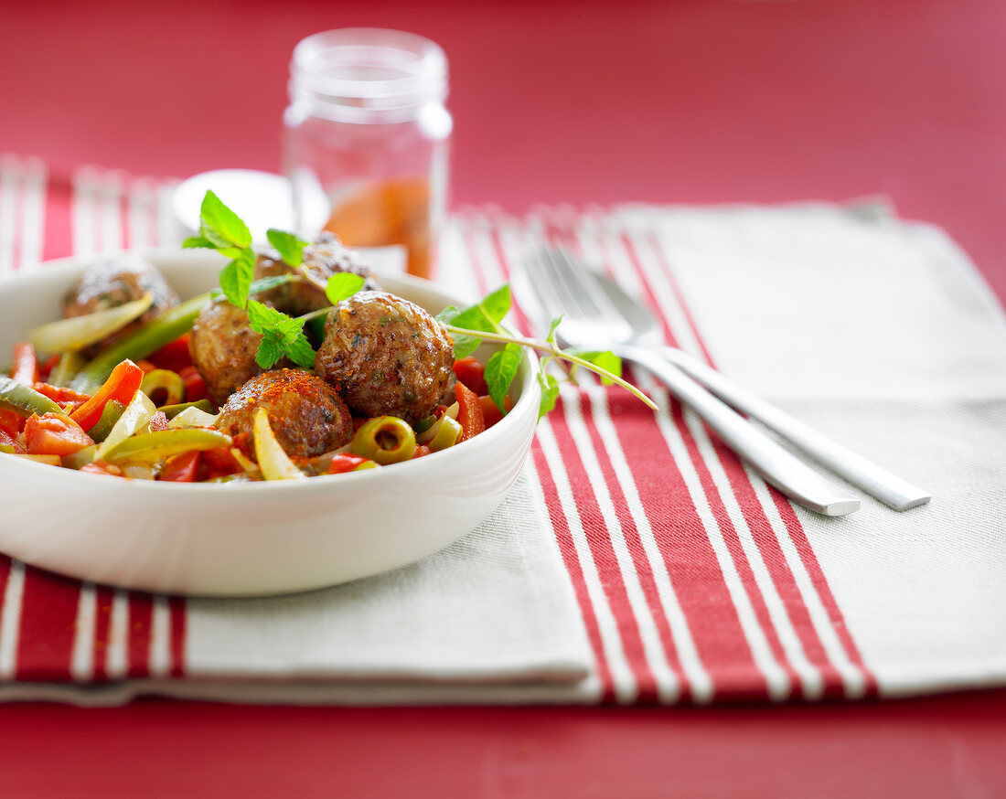 Meatballs with peppers,tomatoes and green olives