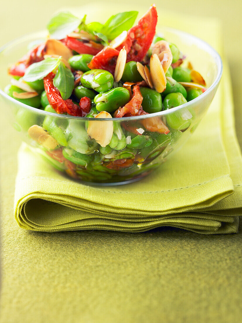 Broad bean salad with thinly sliced almond and sun-dried tomatoes