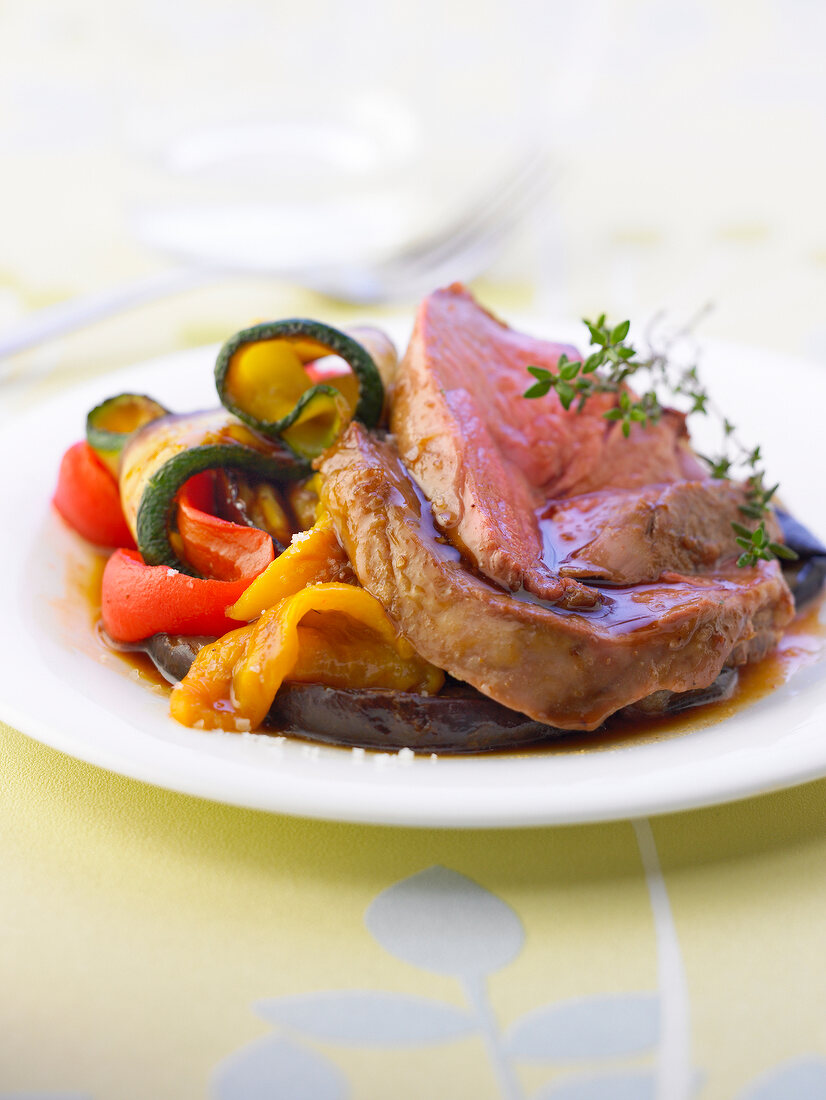 Sliced leg of lamb with southern vegetables