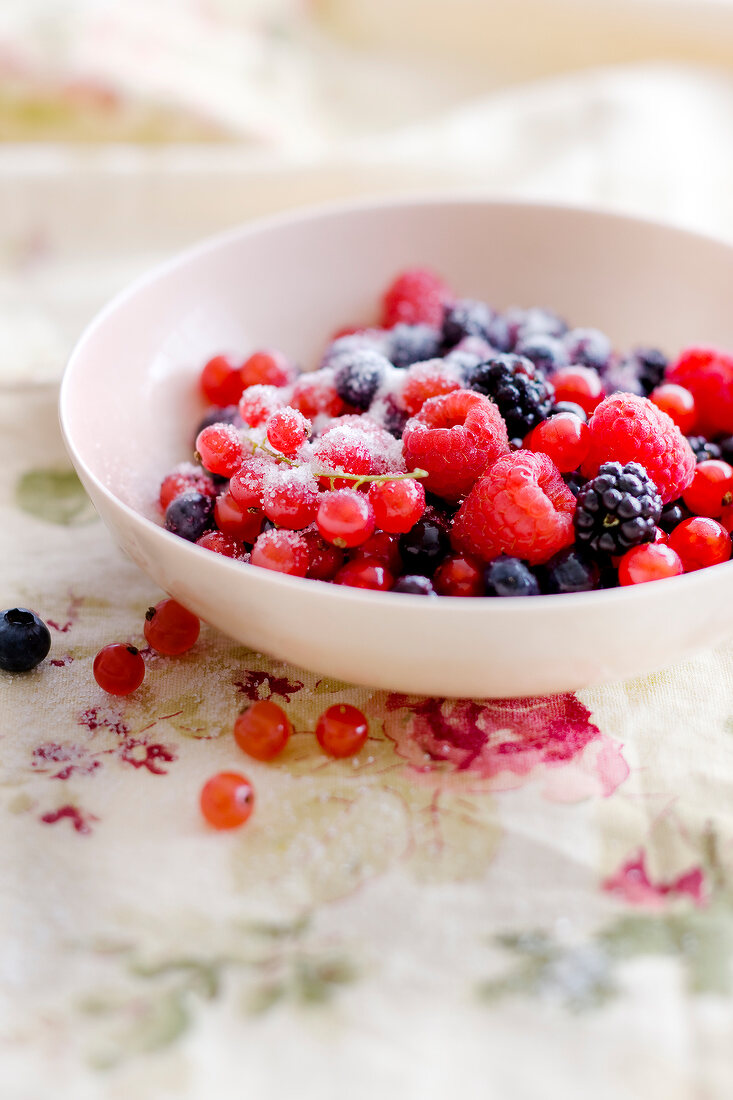 Mixed summer fruit with sugar
