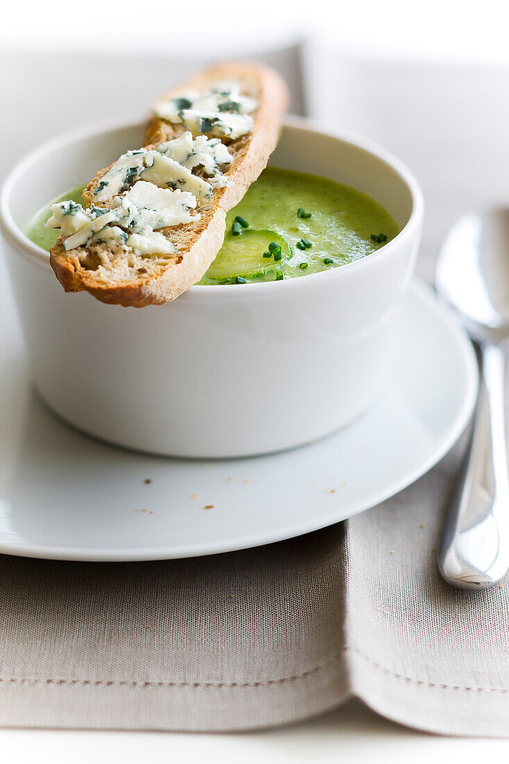Cream of zucchini soup with Roquefort on toast