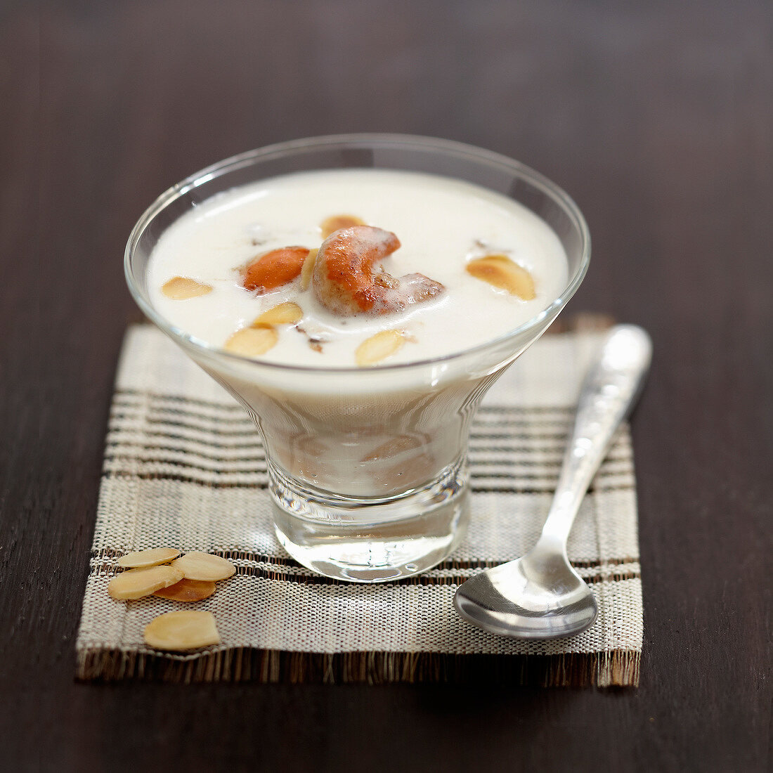 Cream of scallop soup with thinly sliced almonds