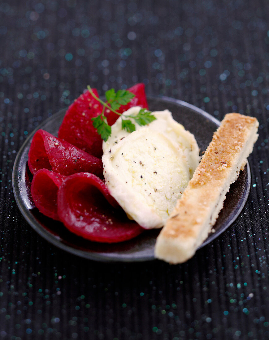 Sliced beetroot with goat's cheese