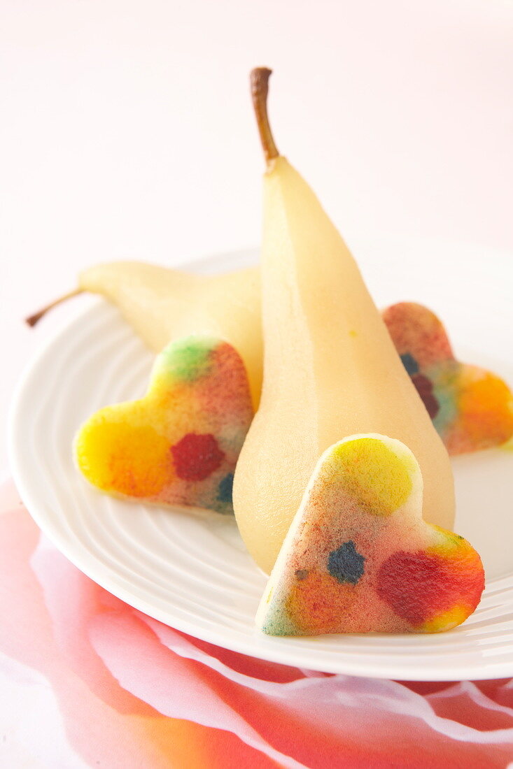 Multicolored jelly fruit hearts with poached pears