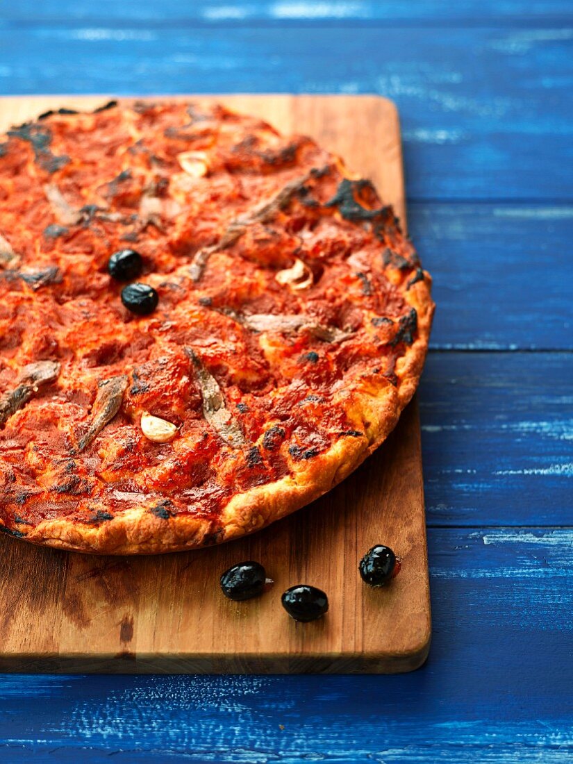 Red focaccia with anchovies