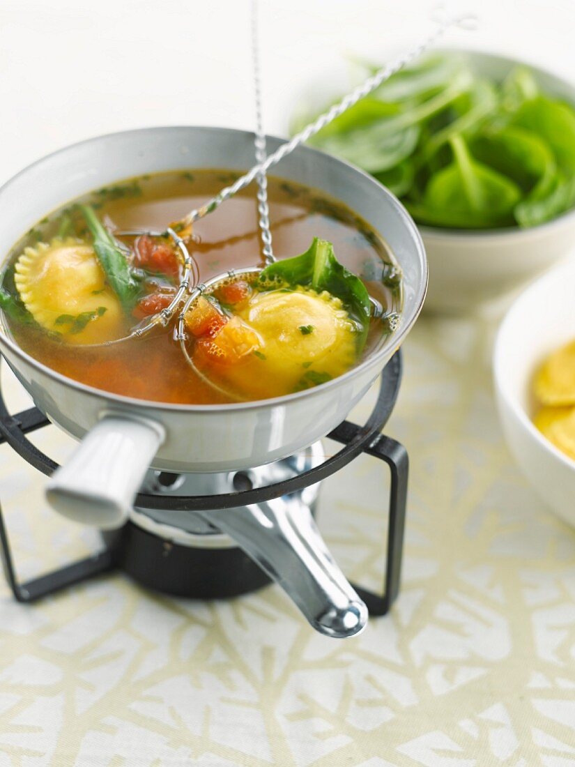 Tomato broth with raviolis