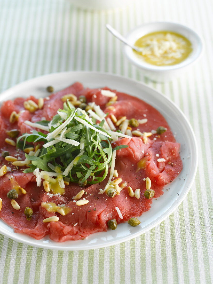 Beef carpaccio with pine nuts and capers