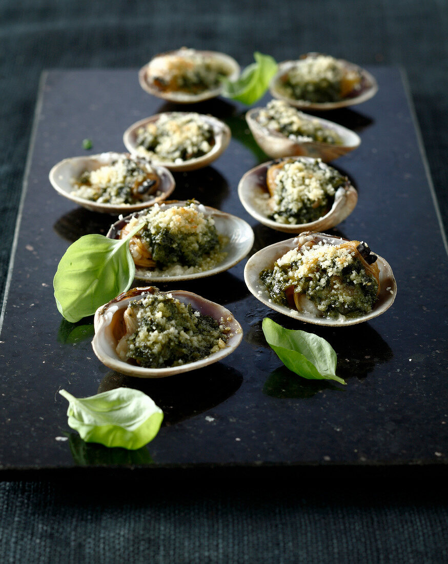 Littleneck clams grilled with hazelnut and basil butter