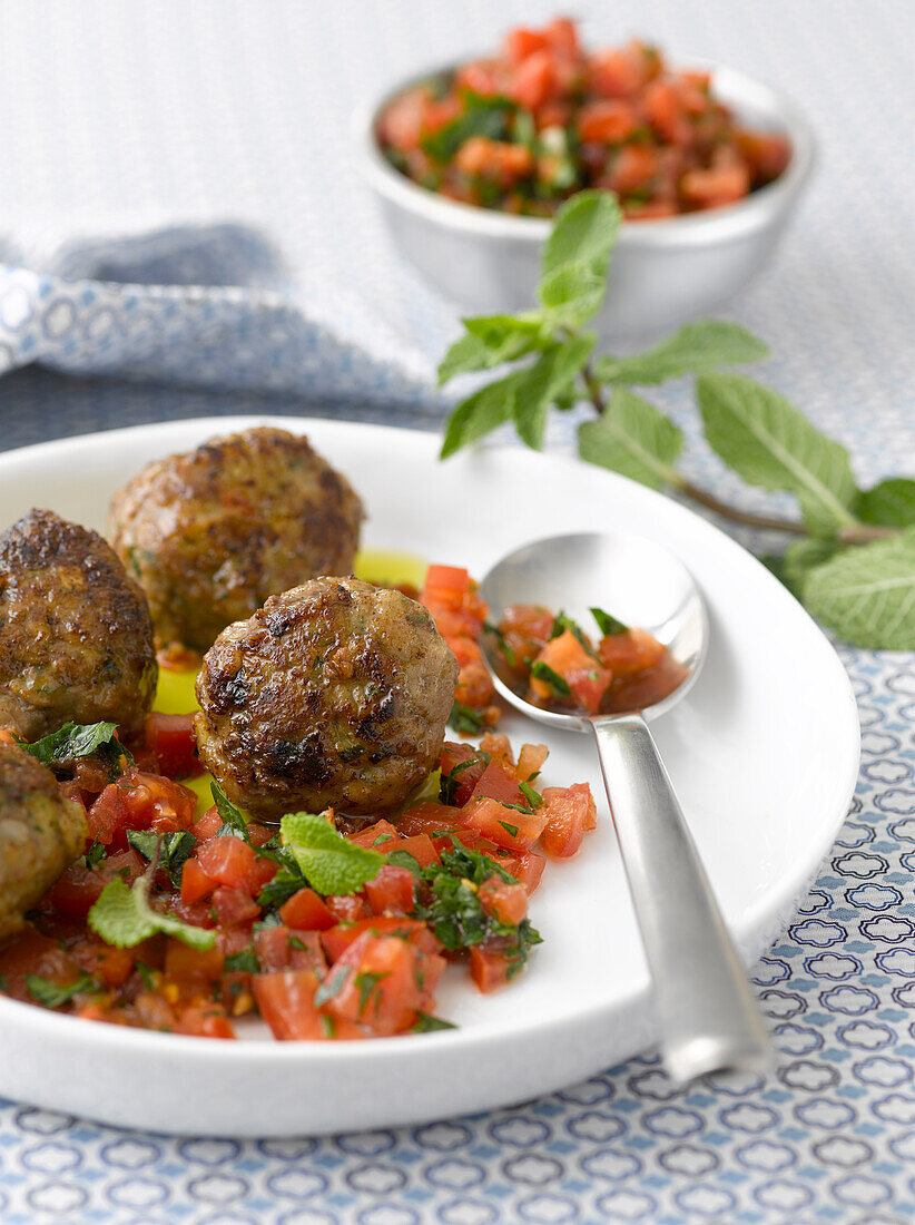 Minty beef meatballs with a diced tomato salad