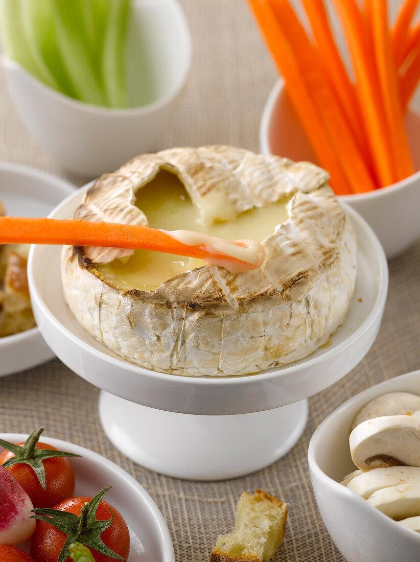 Hot runny Camembert served with raw vegetables