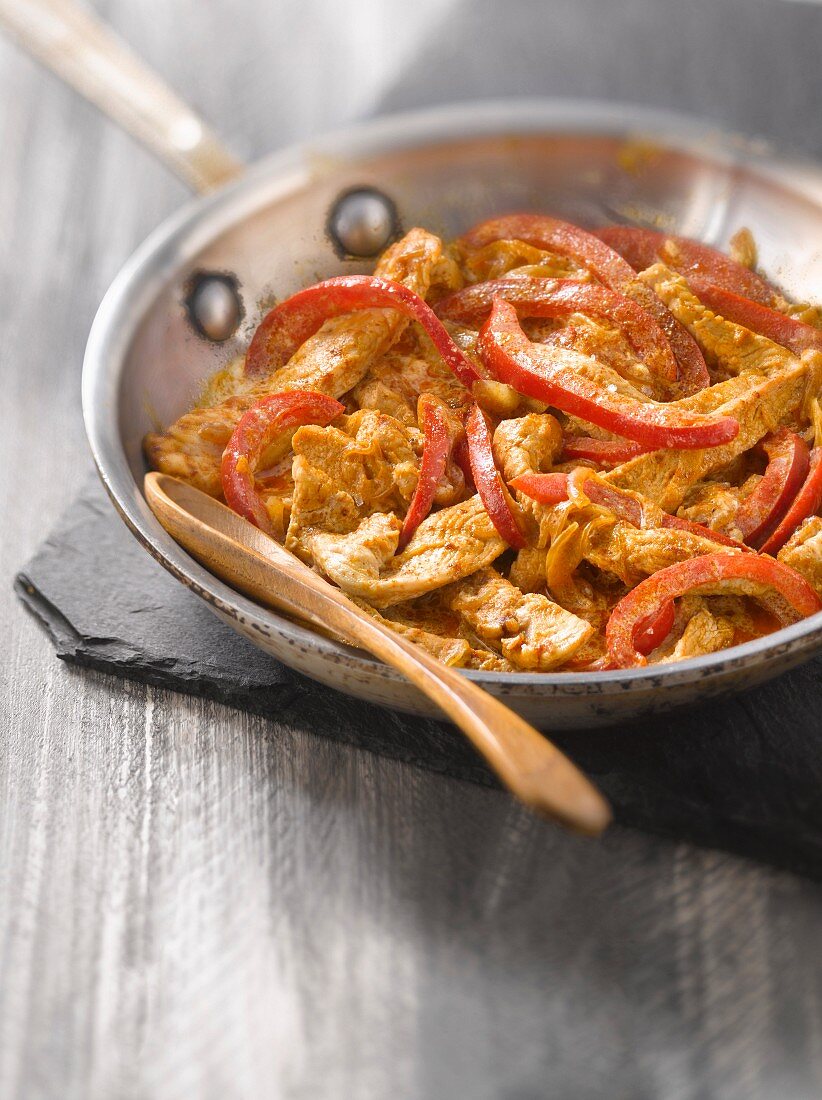 Sauteed turkey with red bell peppers and paprika