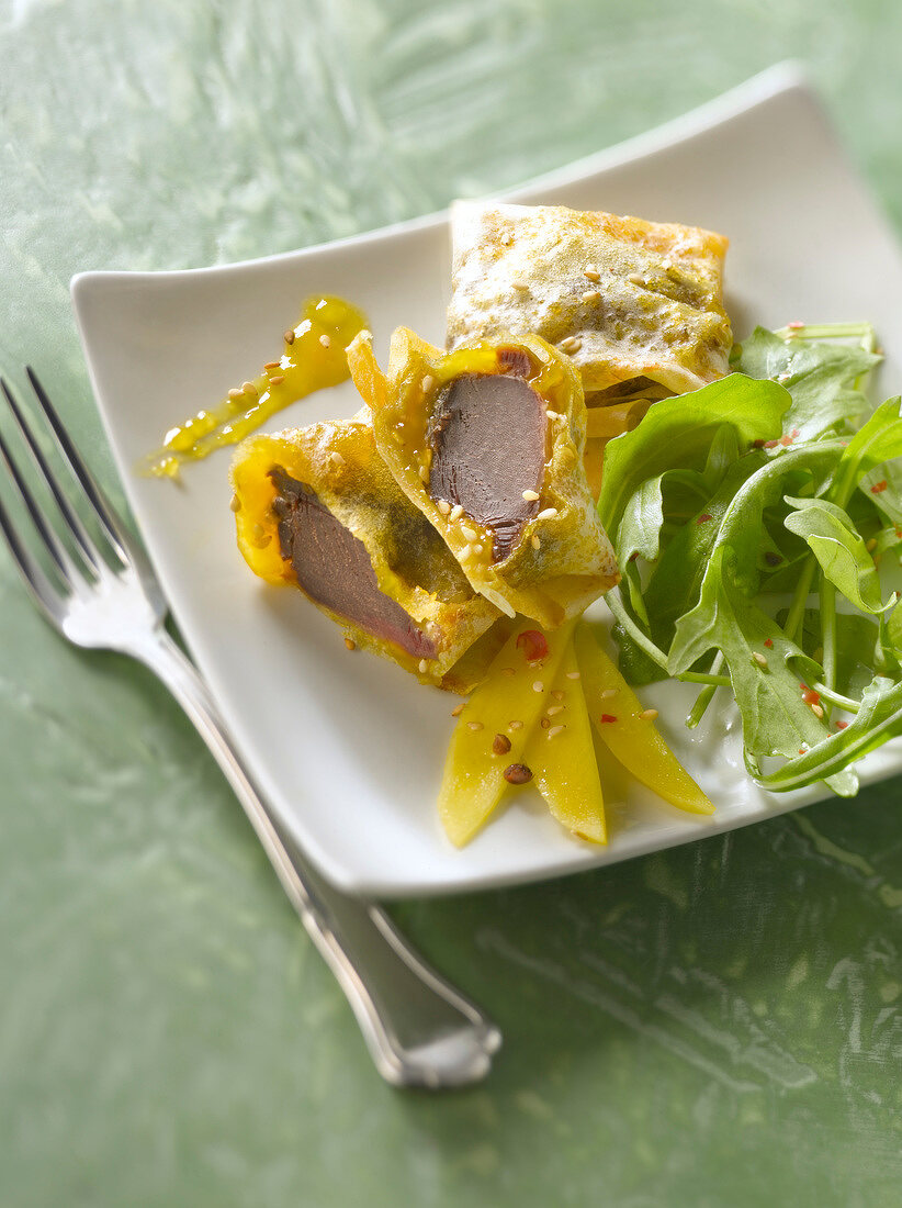Confit gizzards in filo pastry with mango chutney