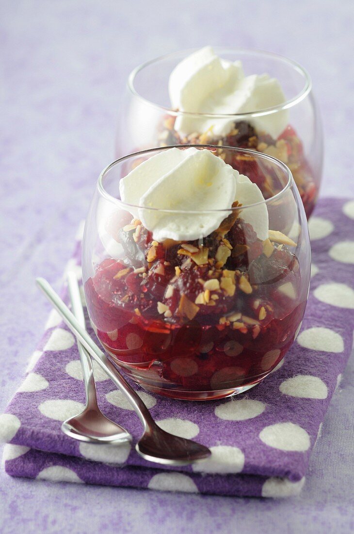 Stewed cranberries with crushed nuts and coconut mousse