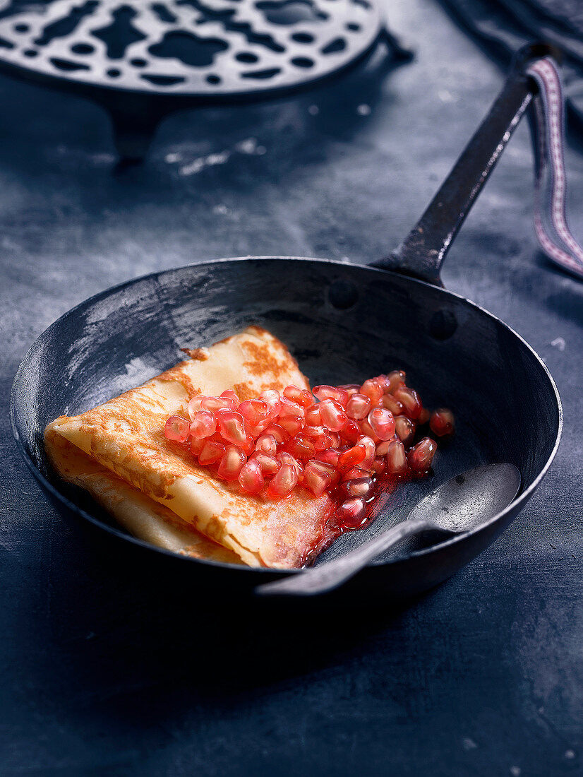 Pancake with pomegranate seeds