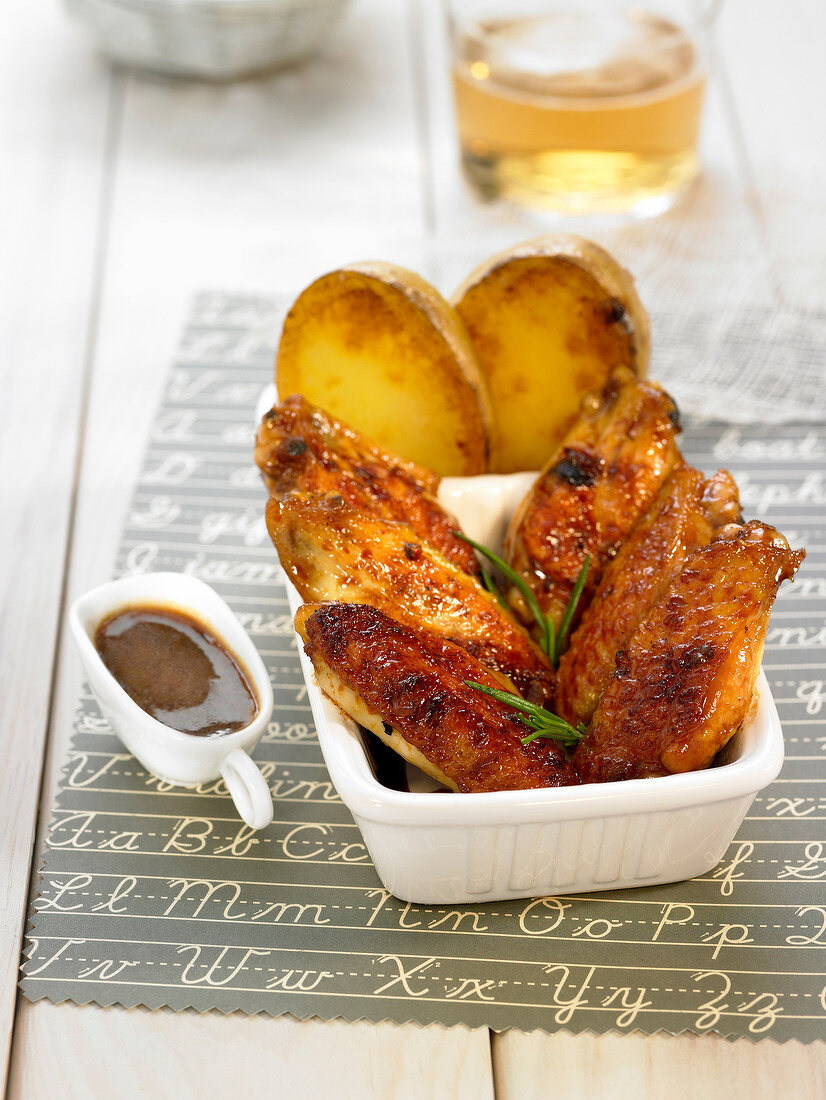 Caramelized chicken wings and sauteed potatoes