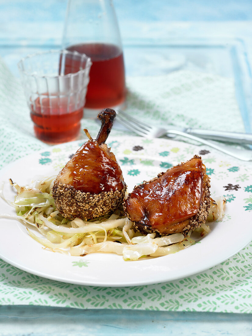 Glazed chicken with sesame seeds and sauteed cabbage