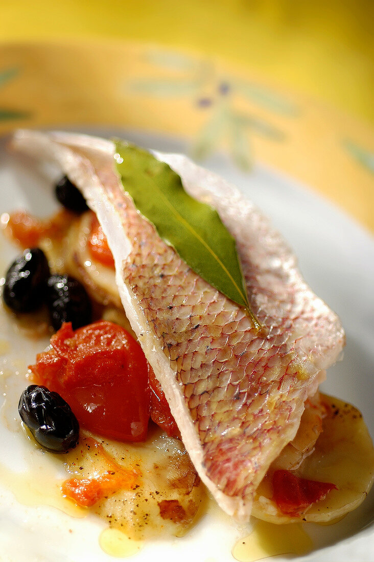 Sea bream fillet with tomatoes and olives