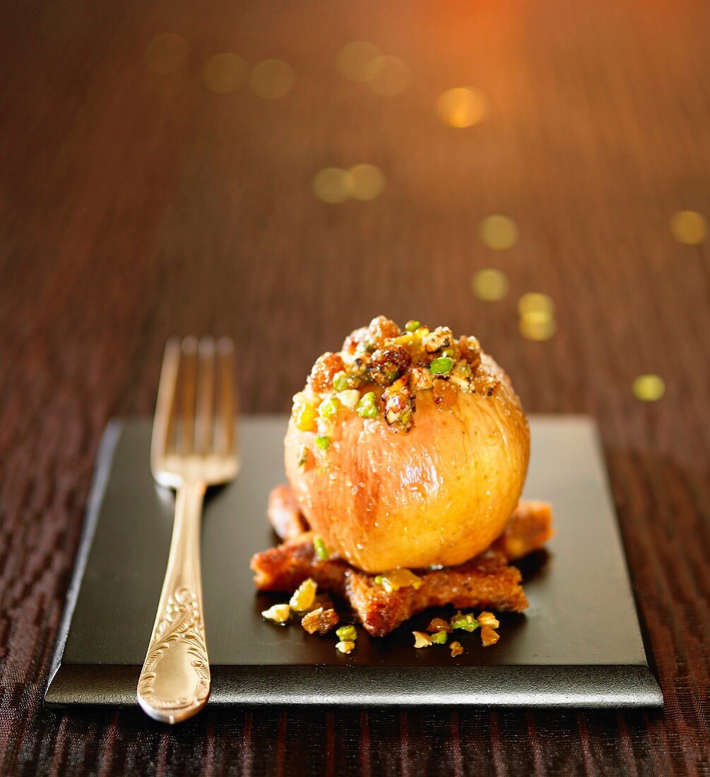 Baked apple stuffed with dried fruit and gingerbread