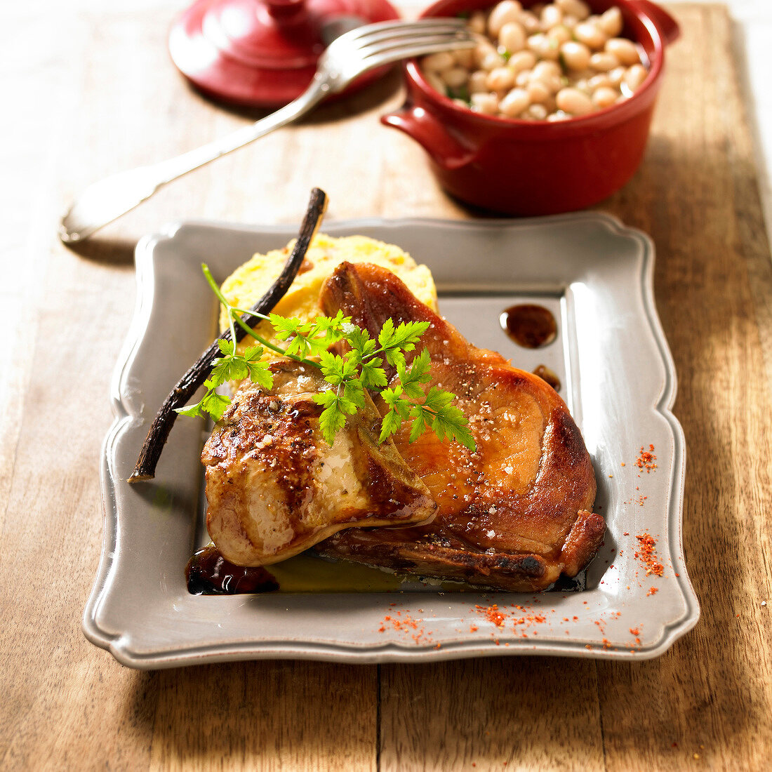 Rossini pork chops with licorice sauce,mashed potatoes and white haricot bean casseole