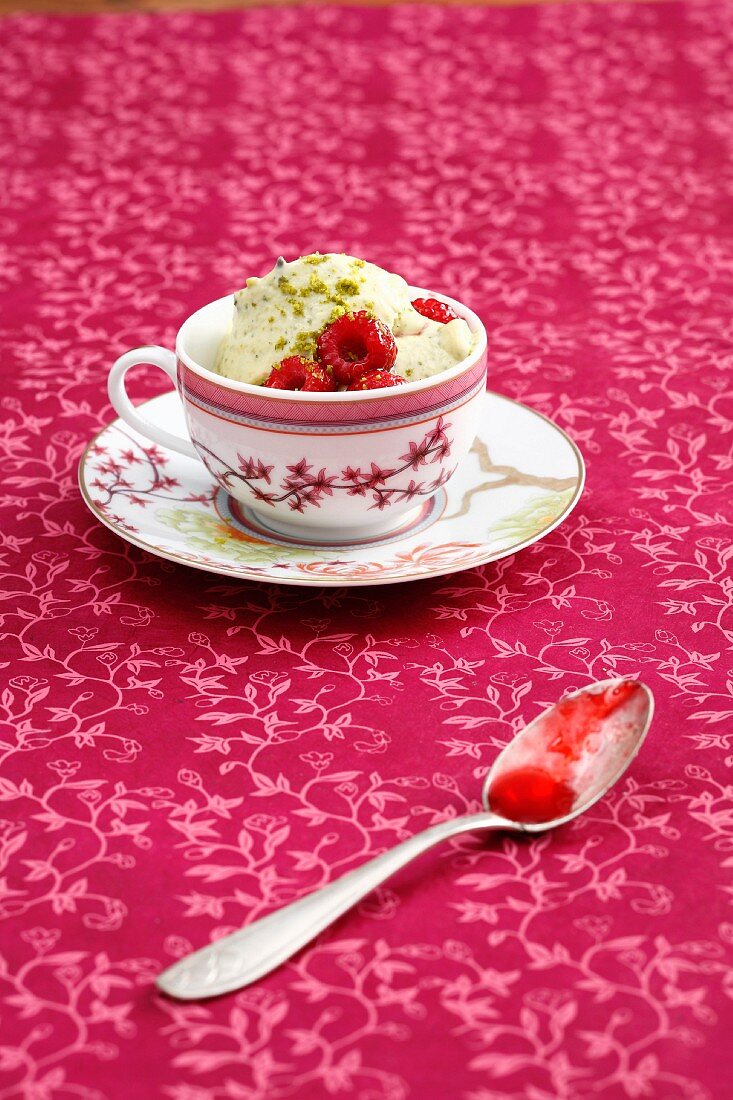 Roasted pistachio ice cream with raspberries