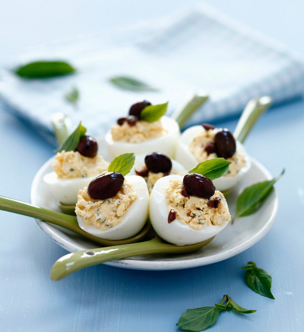 Stuffed hard-boiled eggs with Nice black olives and basil