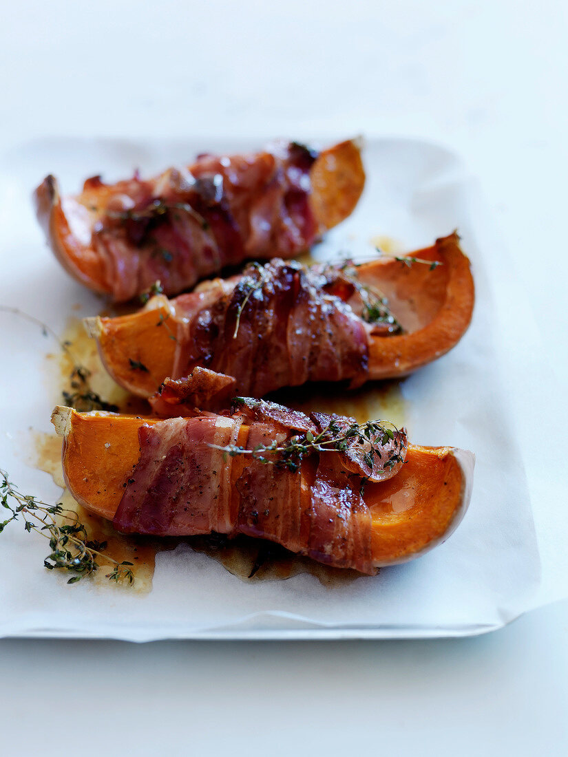 Butternut squash wrapped in bacon with thyme