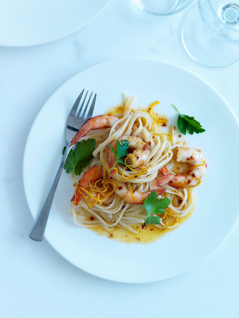 Pasta with shrimps marinated in hot red pepper and lemon zests