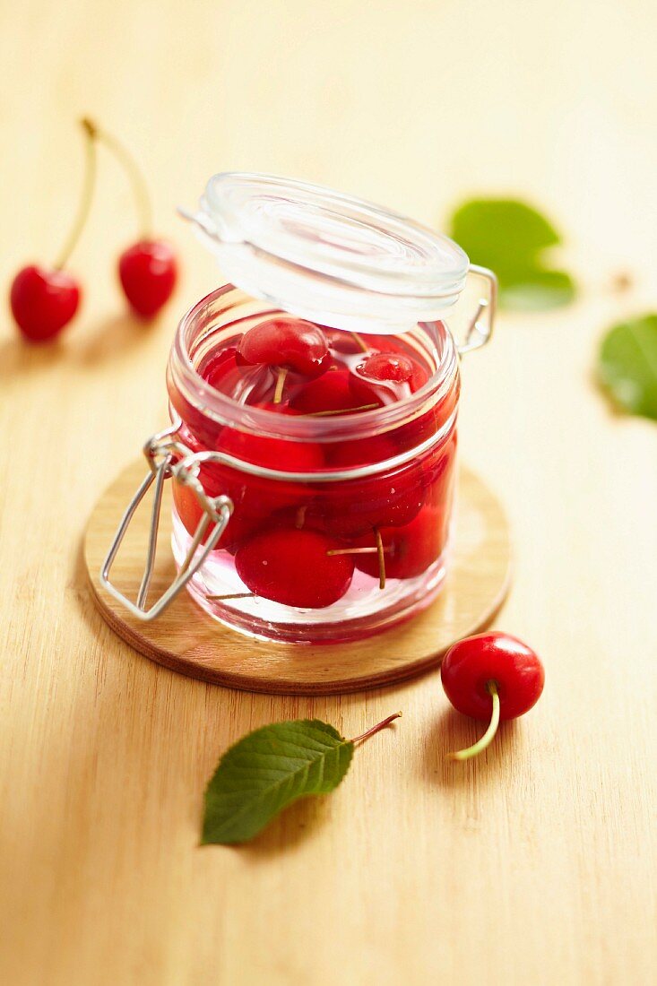 Jar of cherries pickled in vinaigar