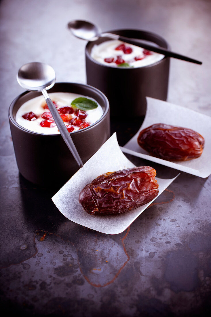 Dates and yoghurt with pomegranate seeds