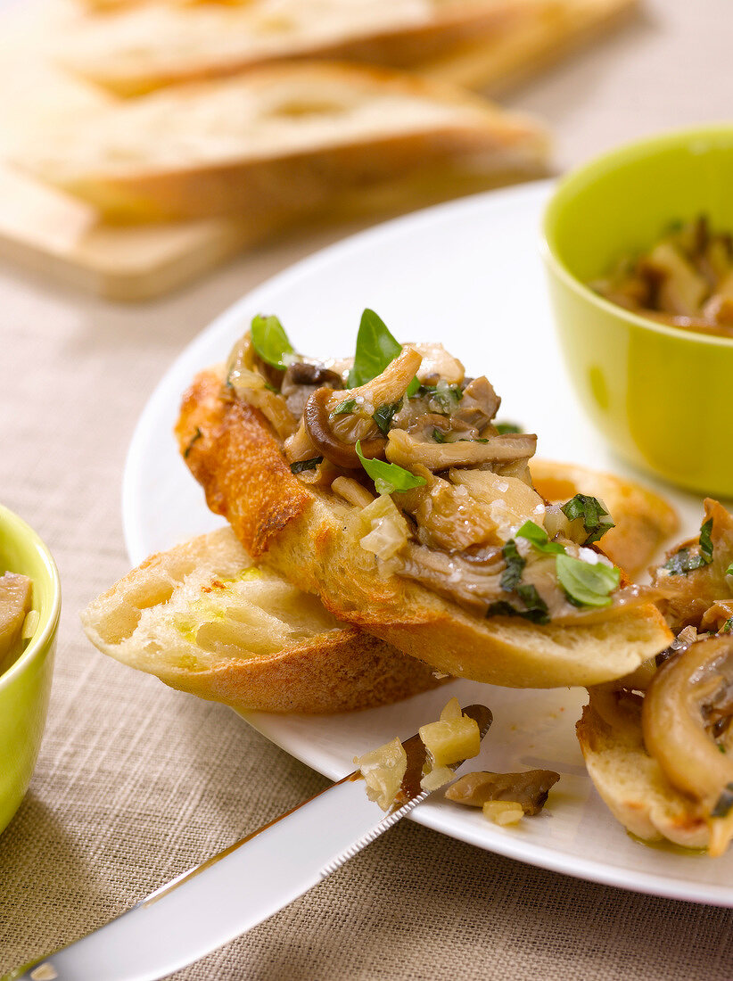 Pleurotus mushrooms with herbs on sliced bread