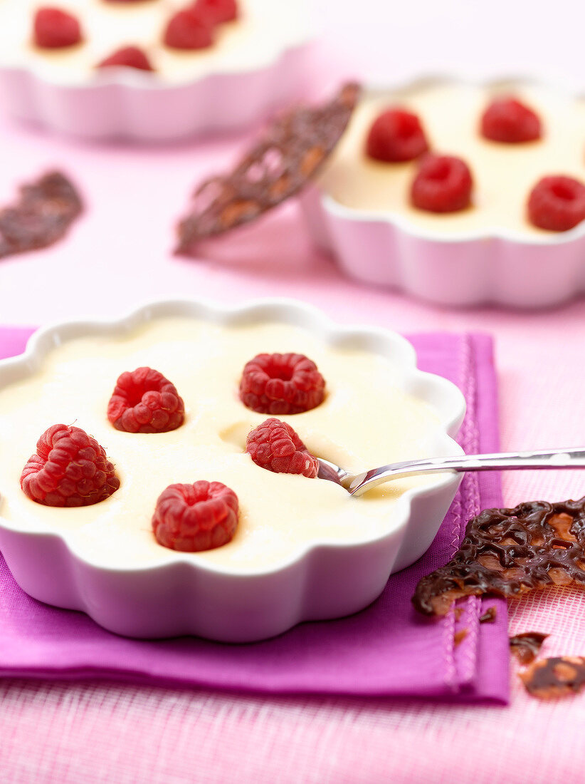 Catalan cream dessert with raspberries, chocolate-orange tuiles