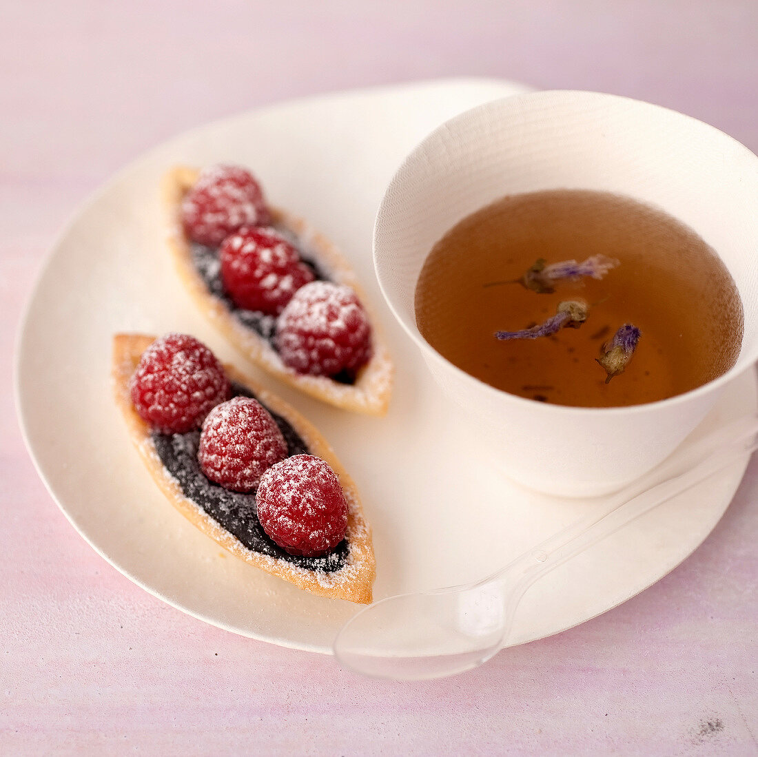 Chocolate-raspberry tartlets and a cup of tea