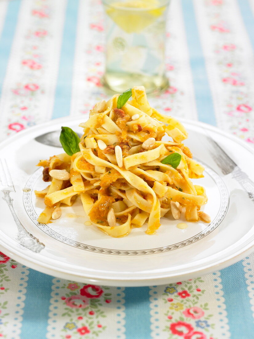 Tagliatelles in pumpkin sauce with pinenuts