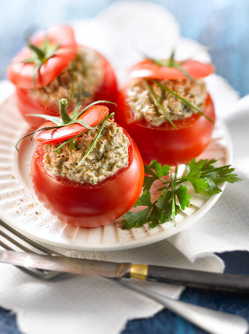 Tomatoes stuffed with potted sardines, cream cheese and herbs