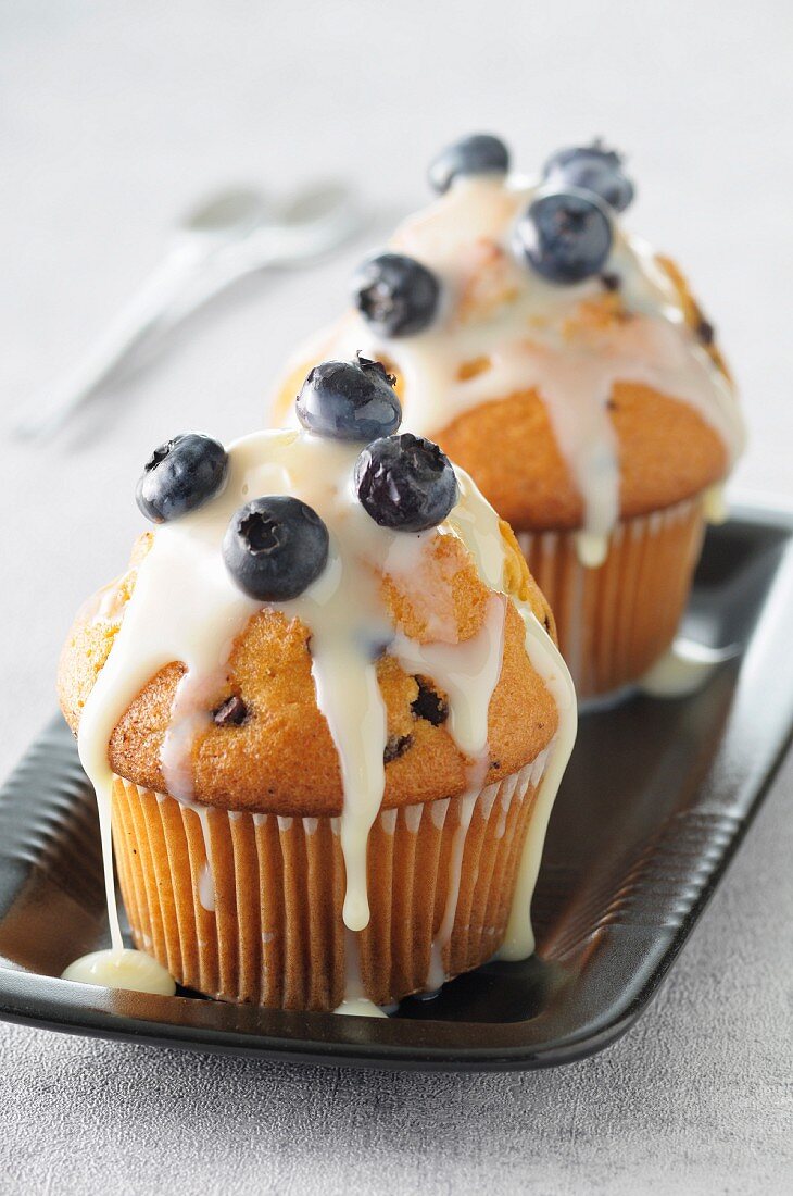 Chocolate chip muffins with blueberry frosting
