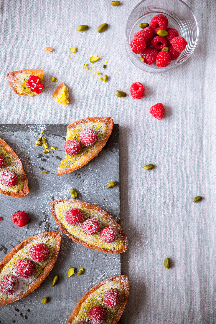 Pistachio and raspberry boat-shaped tartlets