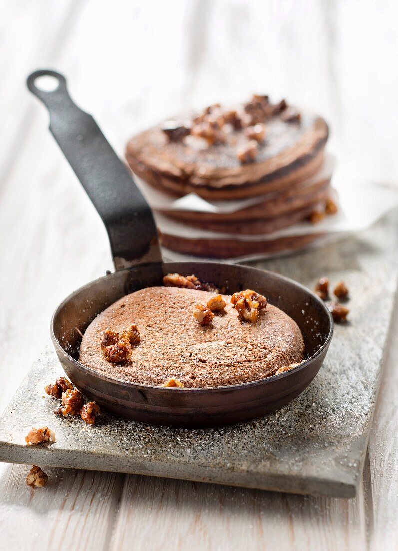 Chocolate pancakes with caramelized crushed pecans