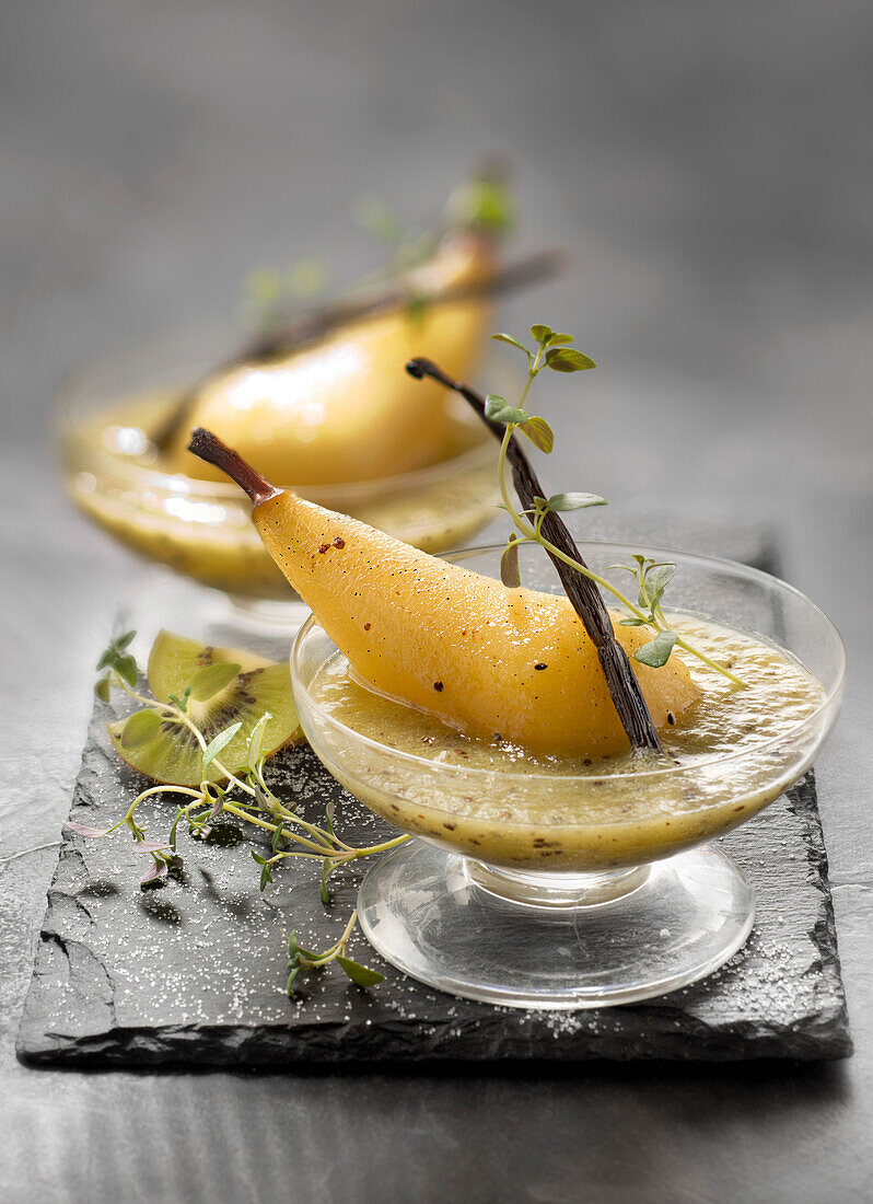 Kiwi soup with stewed pears with vanilla-flavored syrup and lemon thyme