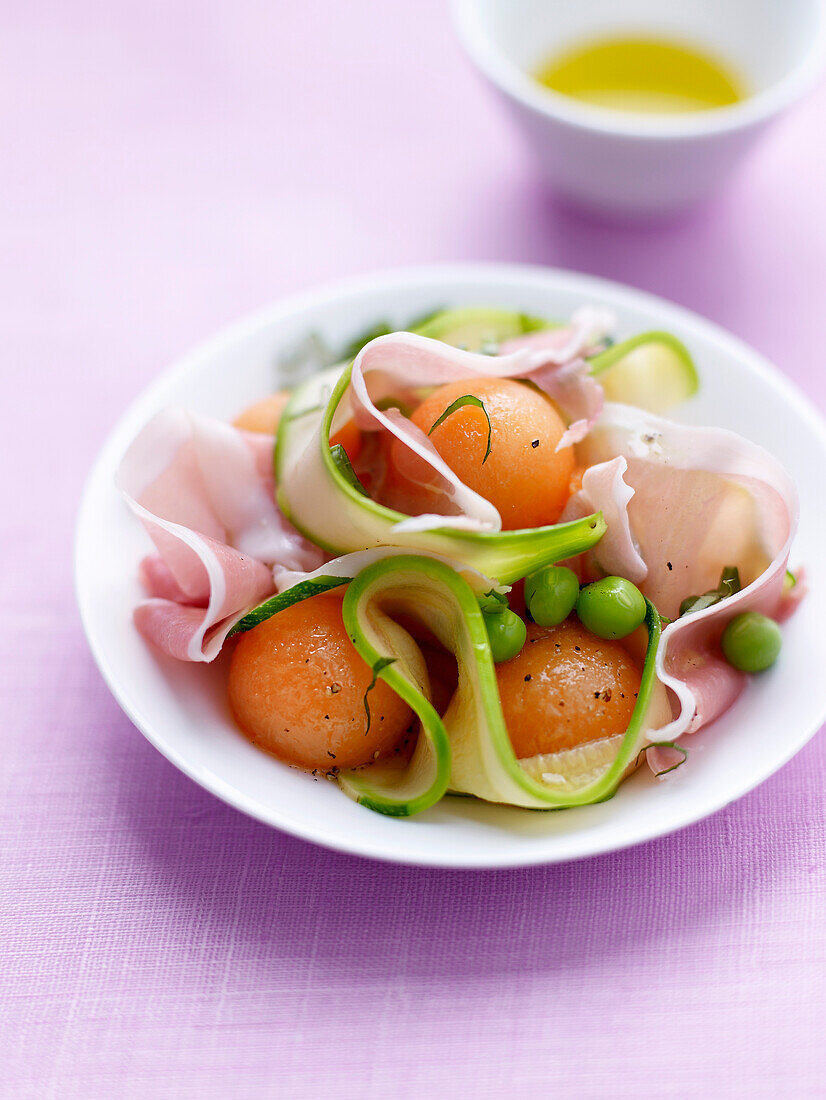 Thin strips of zucchinis,melon ball and Aoste ham salad