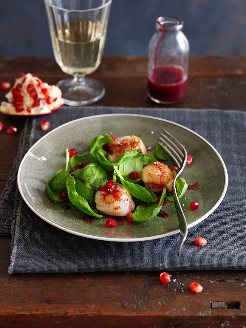 Corn lettuce with caramelized scallops with pomegranate seeds