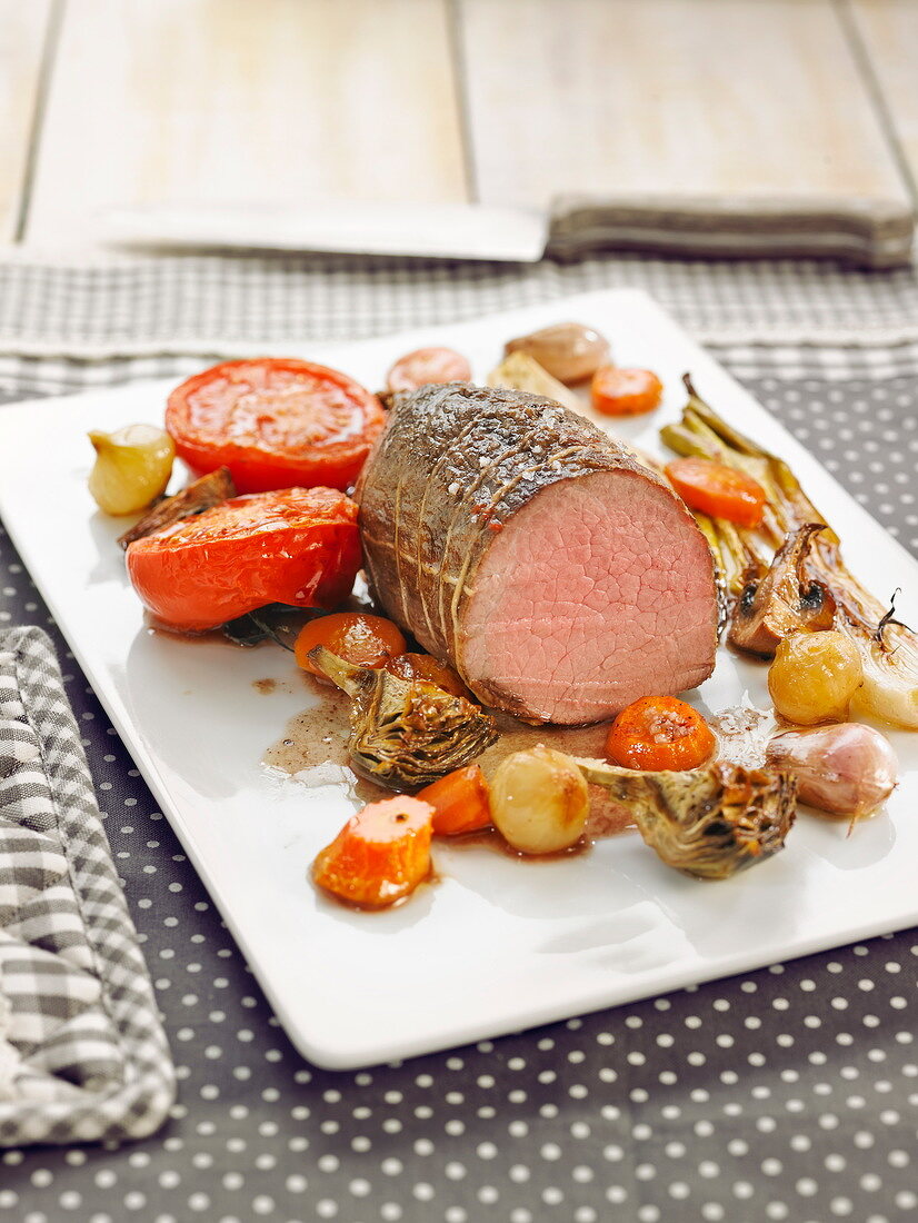 Oven-cooked veal roast with vegetables