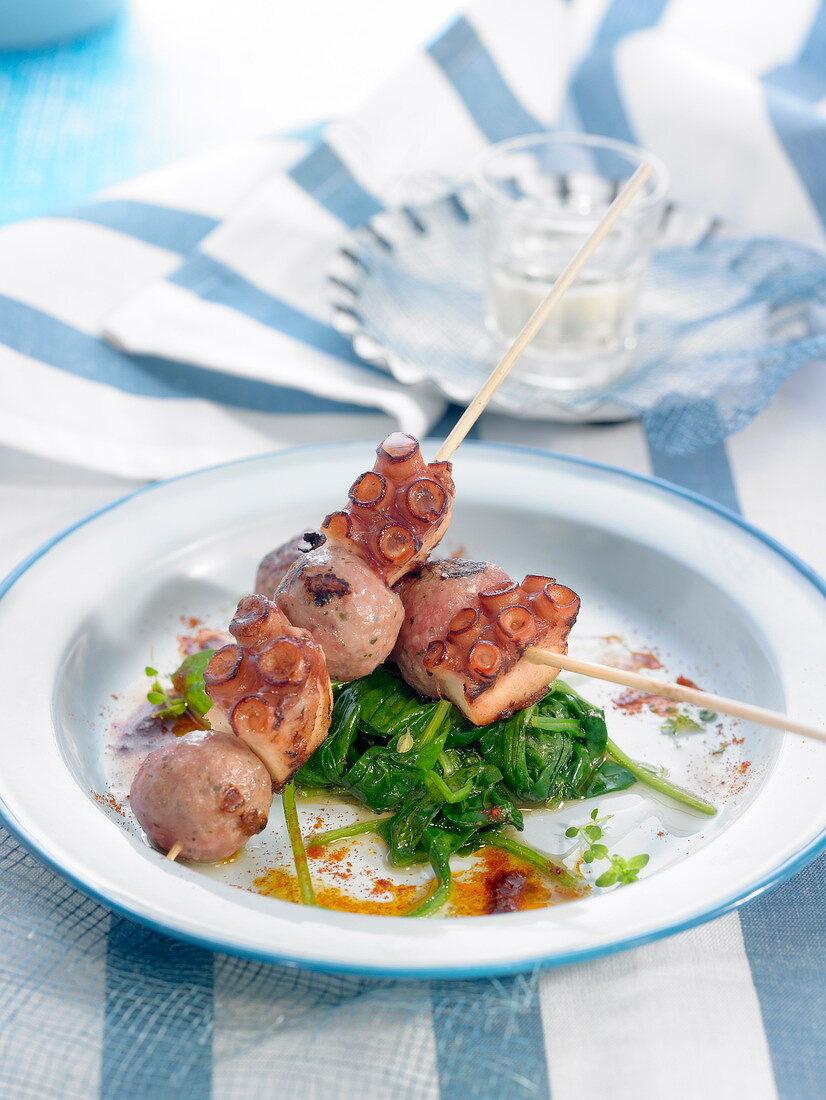 Octopus and sausage meat ball brochettes with spinach