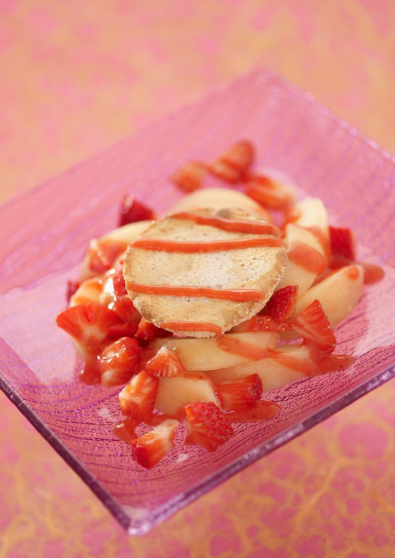 White peach and strawberry fruit salad with a coconut tuile