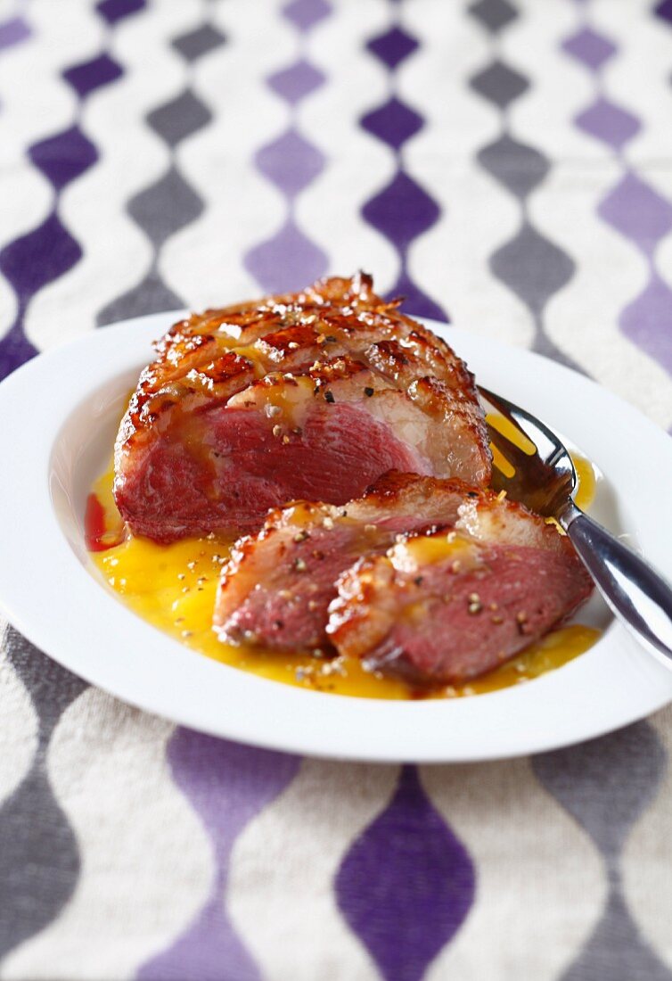Duck magret in honey and orange butter sauce