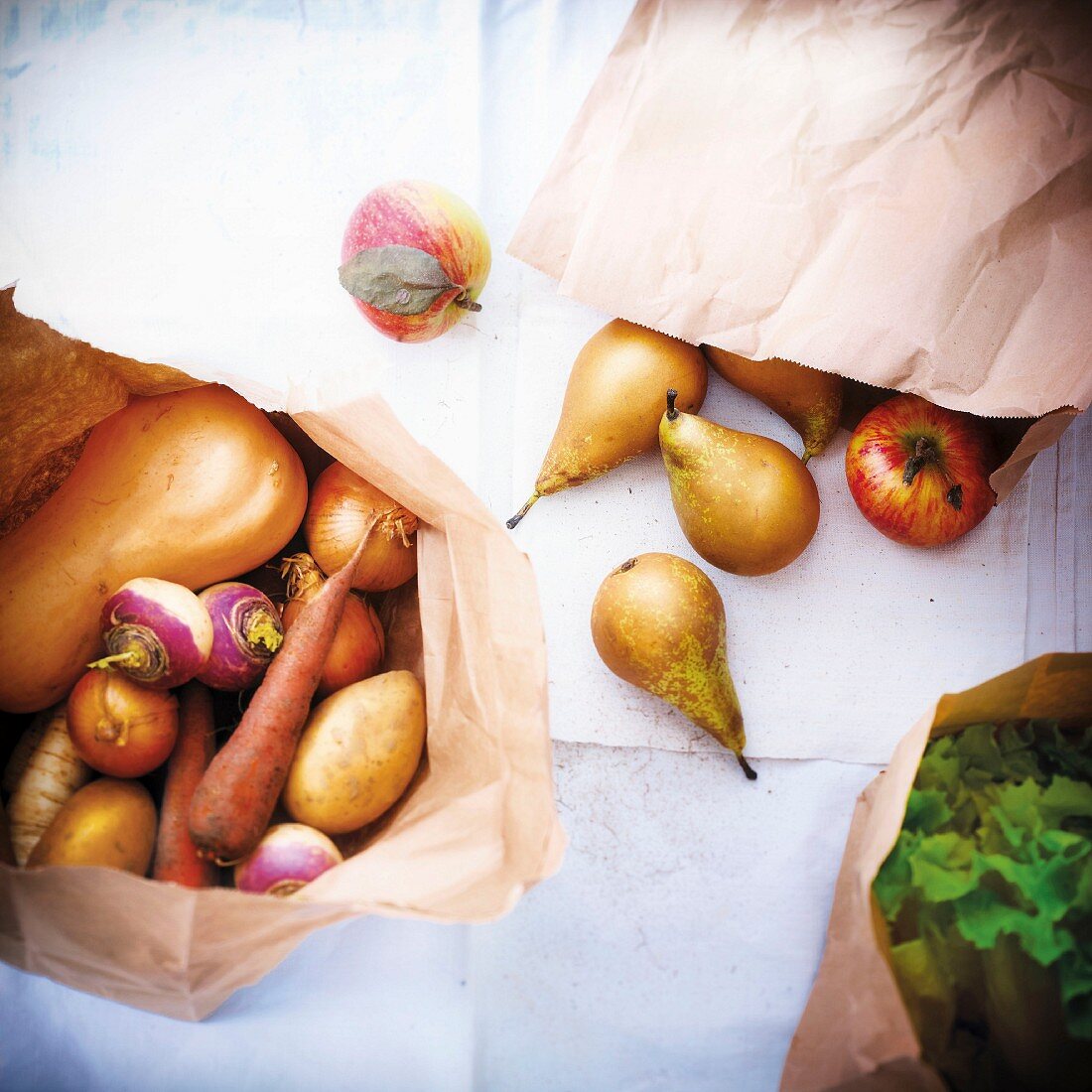 Autumn fruit and vegetables in a brown paper bag