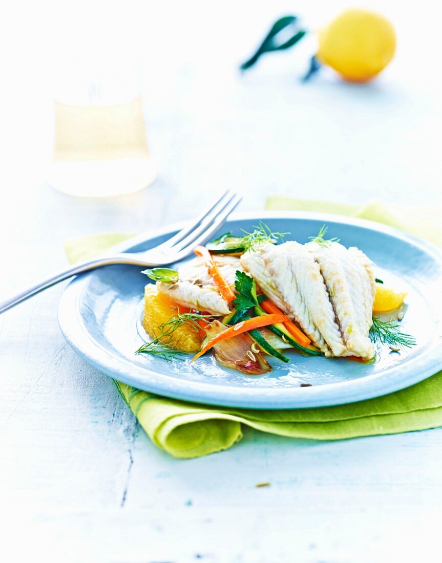 Cod fillets in orange sauce with vegetables