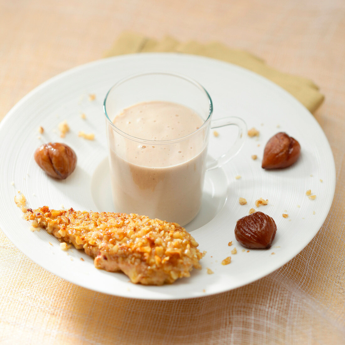 Foie gras coated with crushed nuts and served with chestnut cream