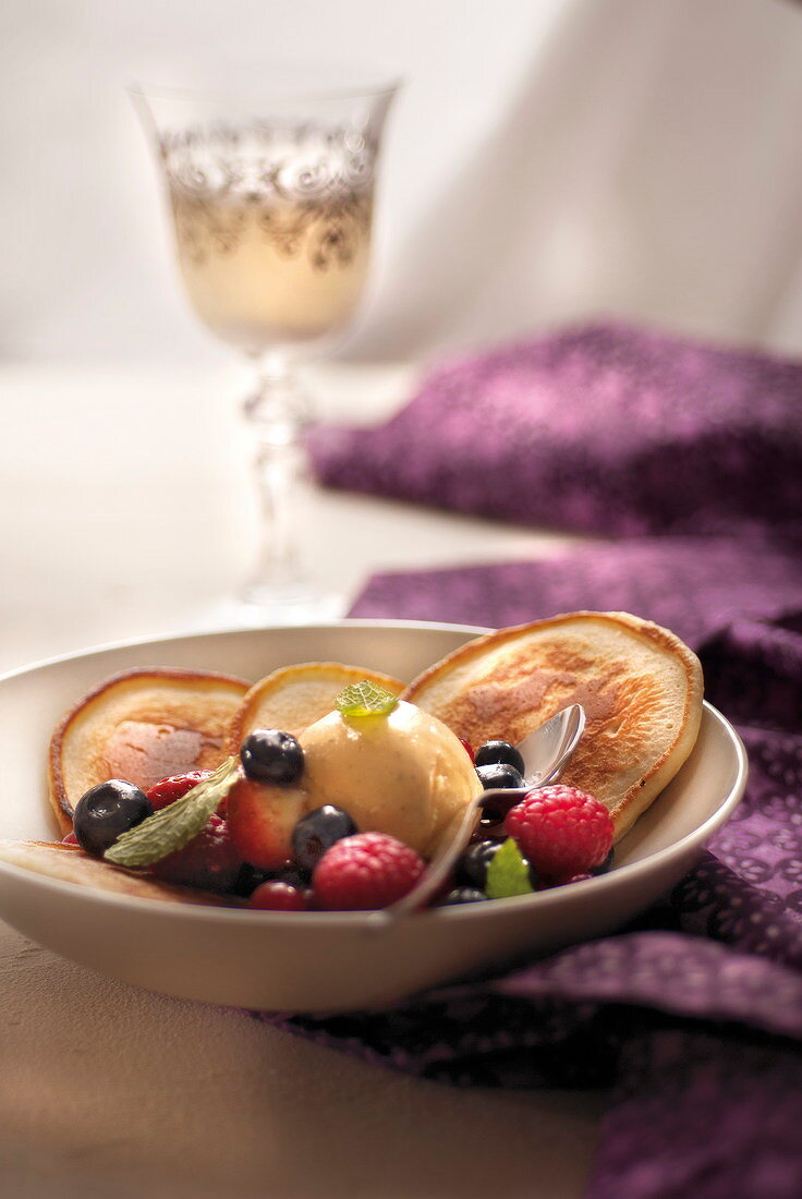 Pancakes with summer fruit and vanilla ice cream
