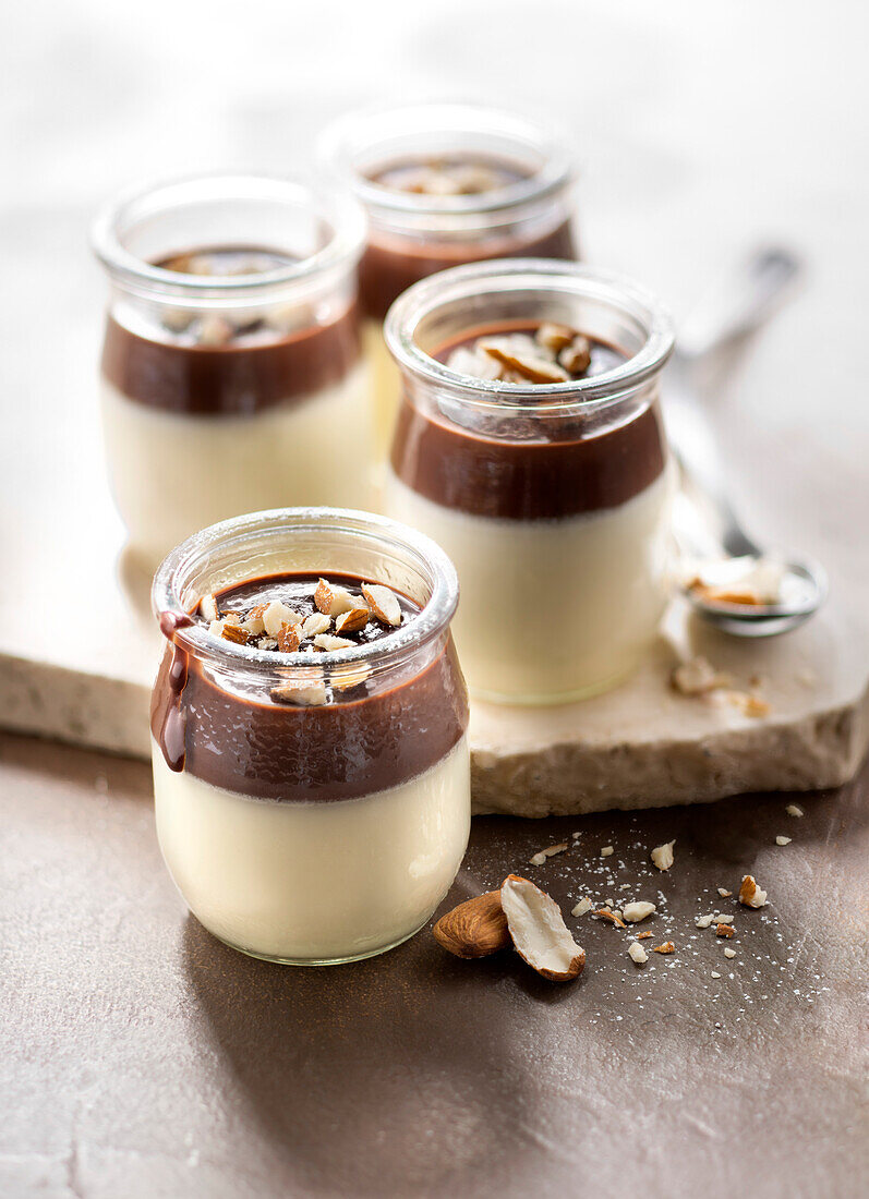 Panna cotta with chocolate sauce and crushed almonds